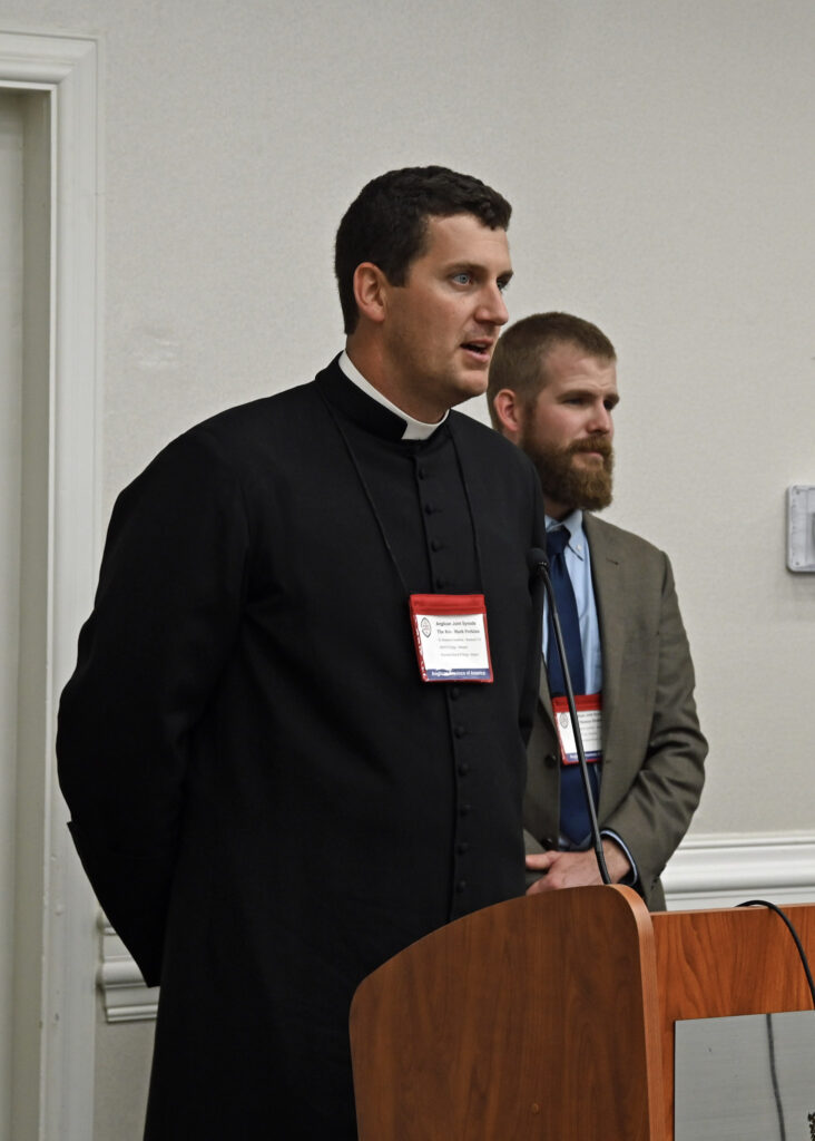 Fr. Perkins presents at the APA's Provincial Synod (while Mr. Fickley does his best Secret-Service impersonation).